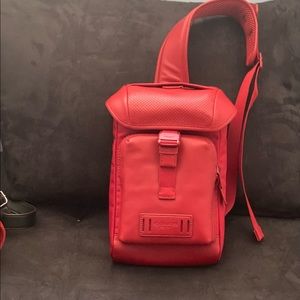 Red sling backpack